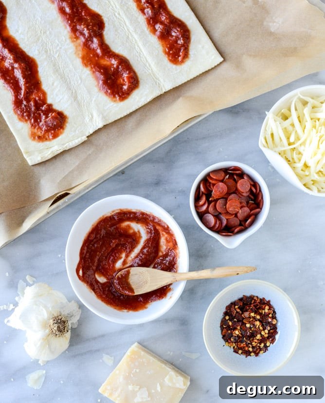 Pepperoni Puff Pastry Pizza Bites: Quick Party Appetizer 3 super easy pepperoni pizza puff pastry I howsweeteats.com