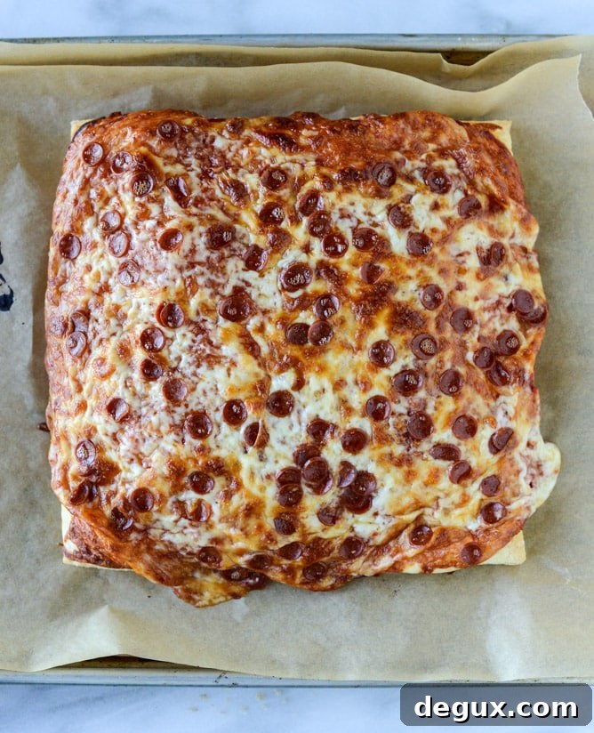 Pepperoni Puff Pastry Pizza Bites: Quick Party Appetizer 5 super easy pepperoni pizza puff pastry I howsweeteats.com