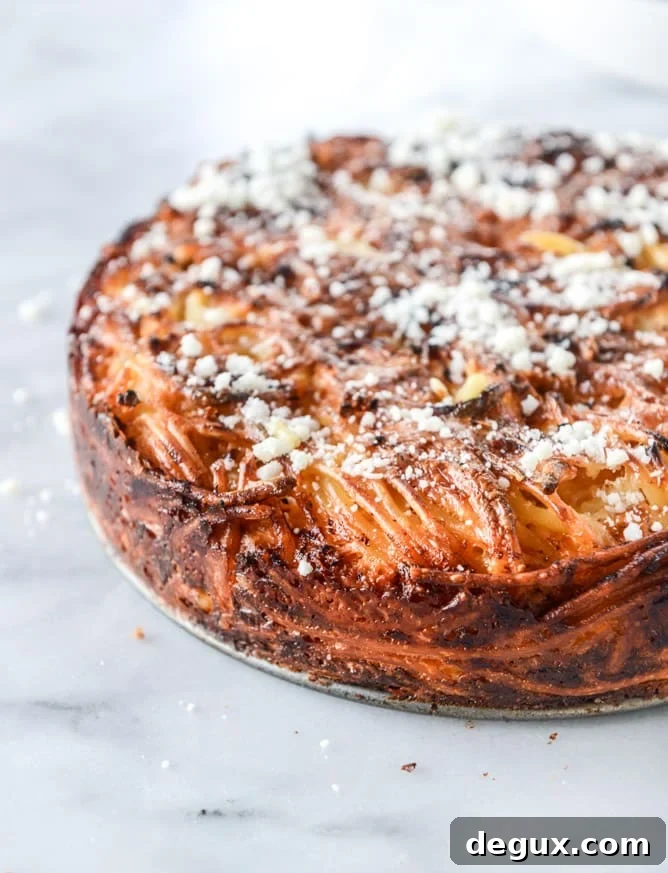 cheesy bucatini pie with mini meatballs I howsweeteats.com