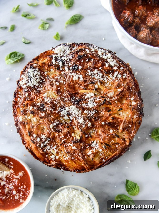 Cheesy Bucatini Pie with Mini Meatballs Recipe 7 cheesy bucatini pie with mini meatballs I howsweeteats.com
