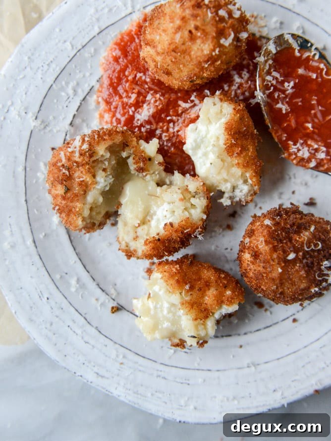 Fontina, Roasted Garlic & Goat Cheese Arancini Recipe 2 fontina, roasted garlic and goat cheese arancini I howsweeteats.com