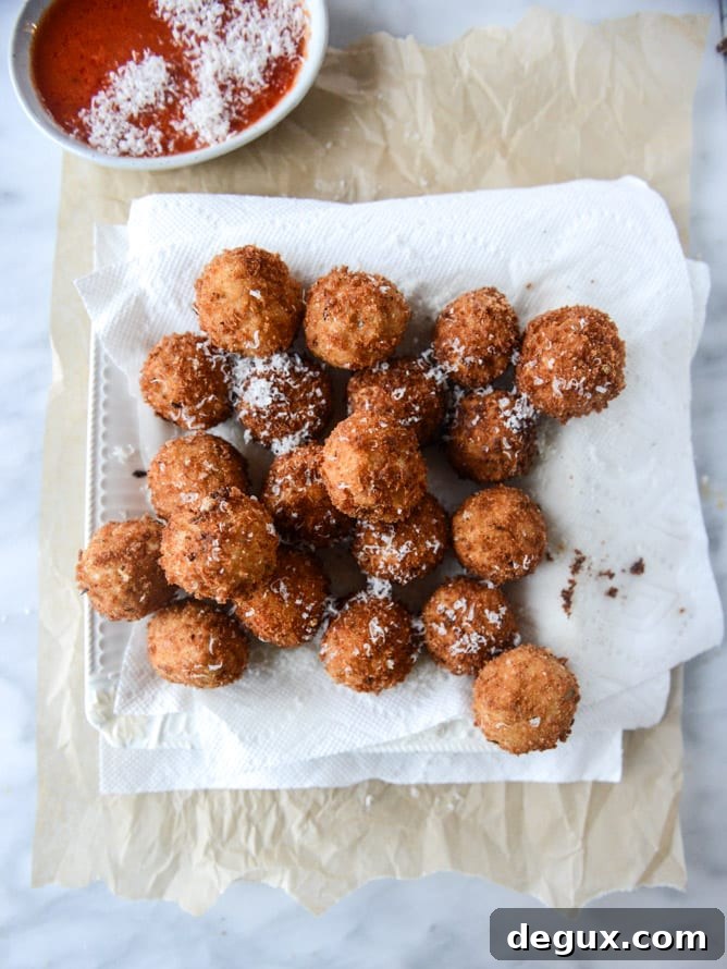 Fontina, Roasted Garlic & Goat Cheese Arancini Recipe 6 fontina, roasted garlic and goat cheese arancini I howsweeteats.com