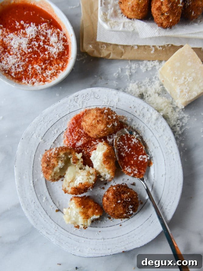 Fontina, Roasted Garlic & Goat Cheese Arancini Recipe 7 fontina, roasted garlic and goat cheese arancini I howsweeteats.com