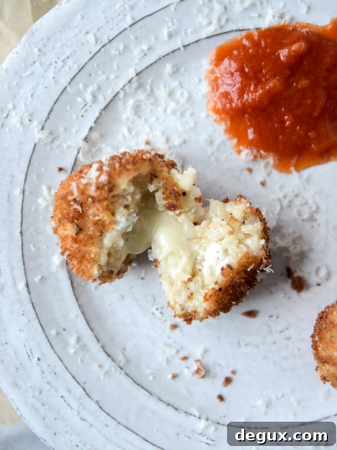 Fontina, Roasted Garlic & Goat Cheese Arancini Recipe 8 fontina, roasted garlic and goat cheese arancini I howsweeteats.com