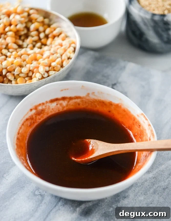 brown sugar sriracha sesame popcorn I howsweeteats.com
