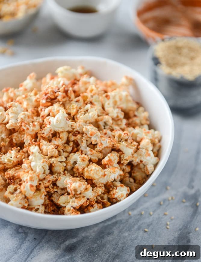 brown sugar sriracha sesame popcorn I howsweeteats.com