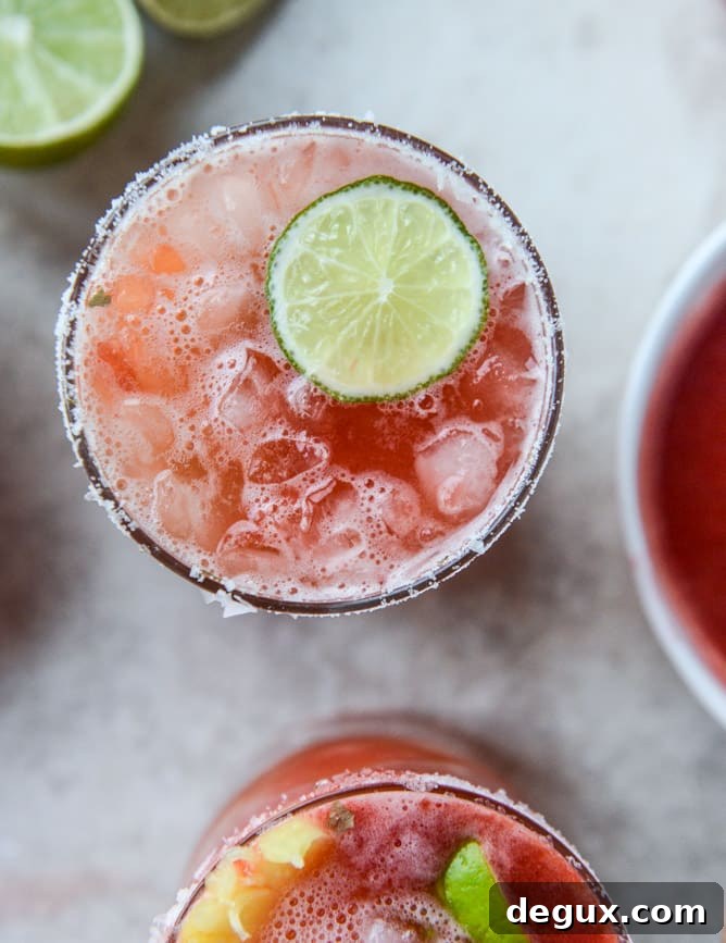 Strawberry-Pineapple Margarita Recipe: Refreshing Summer Cocktail 2 strawberry bottomed pineapple margaritas