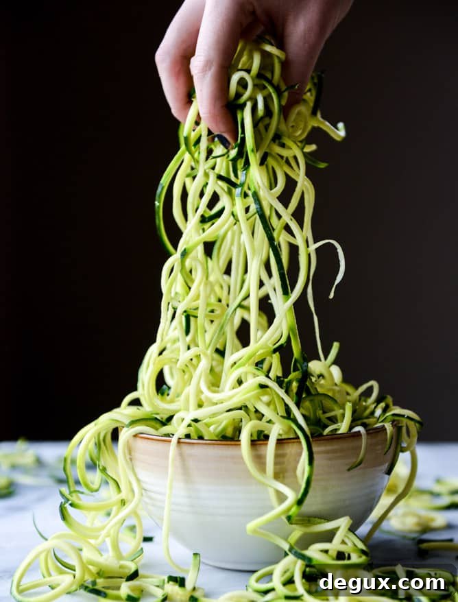 zucchini noodles with garlic tomato cream sauce I howsweeteats.com