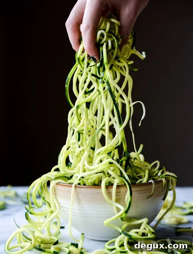 zucchini noodles with garlic tomato cream sauce I howsweeteats.com