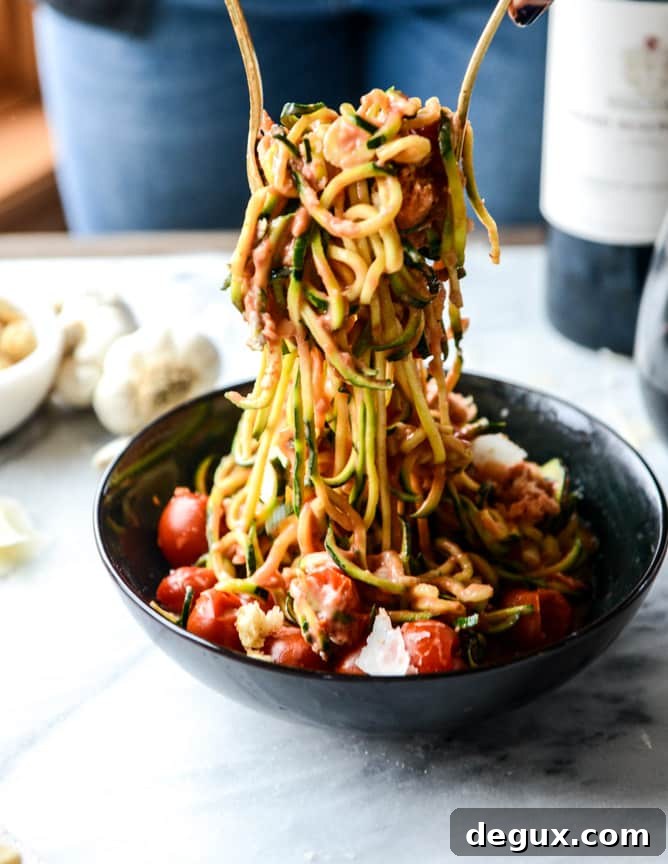 zucchini noodles with garlic tomato cream sauce I howsweeteats.com