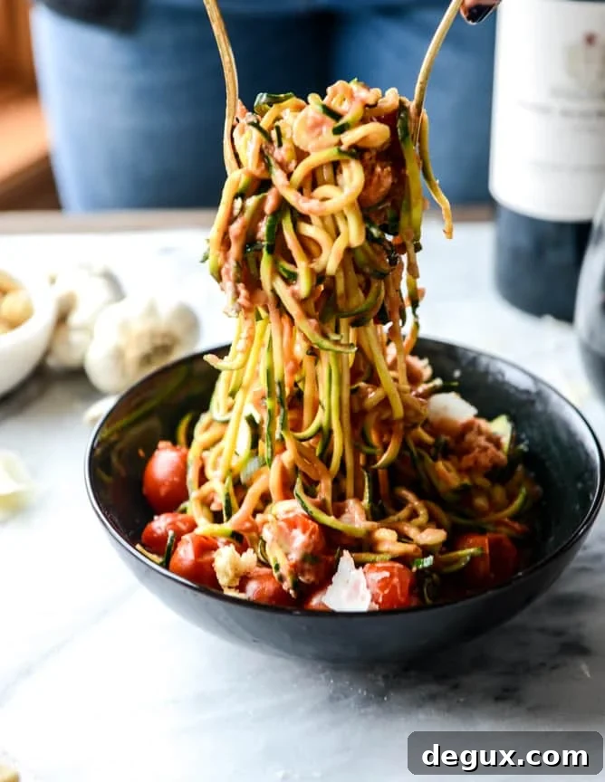 zucchini noodles with garlic tomato cream sauce I howsweeteats.com