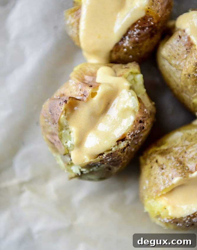 Roasted Cauliflower & Broccoli Stuffed Potatoes with Cheesy Butternut Sauce 4 stuffed potatoes with butternut cheese sauce I howsweeteats.com