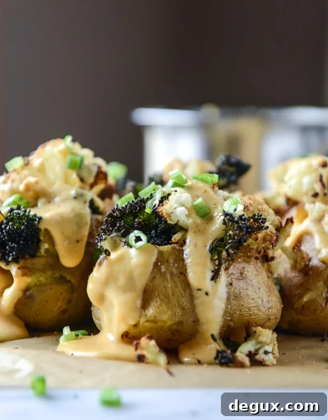 Roasted Cauliflower & Broccoli Stuffed Potatoes with Cheesy Butternut Sauce 5 stuffed potatoes with butternut cheese sauce I howsweeteats.com