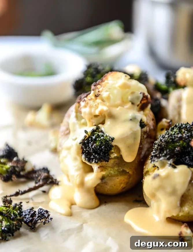 Roasted Cauliflower & Broccoli Stuffed Potatoes with Cheesy Butternut Sauce 7 stuffed potatoes with butternut cheese sauce I howsweeteats.com