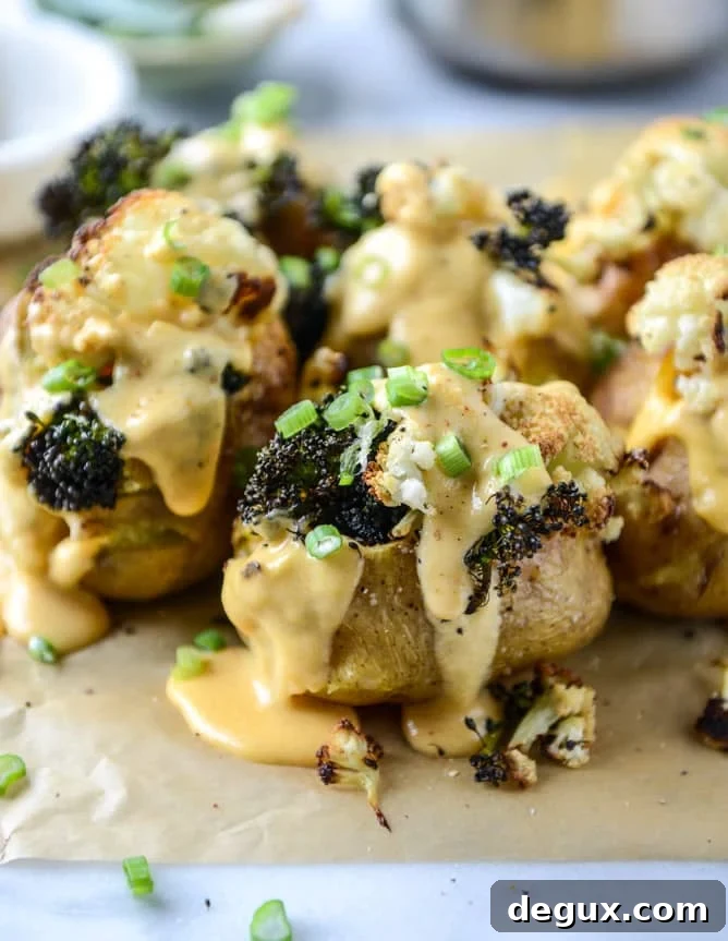 Roasted Cauliflower & Broccoli Stuffed Potatoes with Cheesy Butternut Sauce 8 stuffed potatoes with butternut cheese sauce I howsweeteats.com