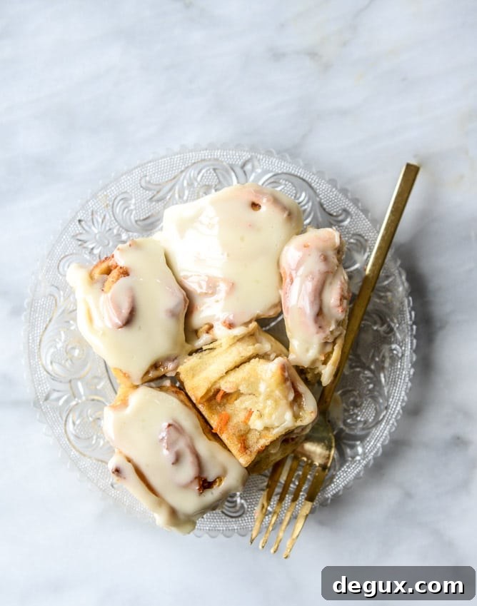 carrot cake cinnamon rolls with mascarpone icing I howsweeteats.com