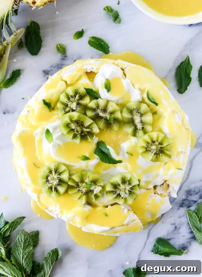 marshmallow pavlova with pineapple curd I howsweeteats.com