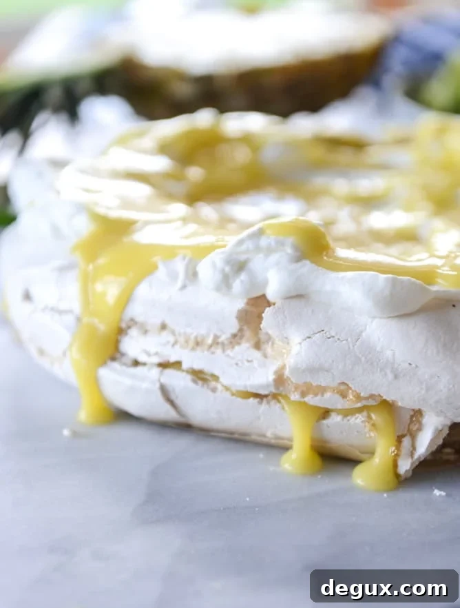 marshmallow pavlova with pineapple curd I howsweeteats.com