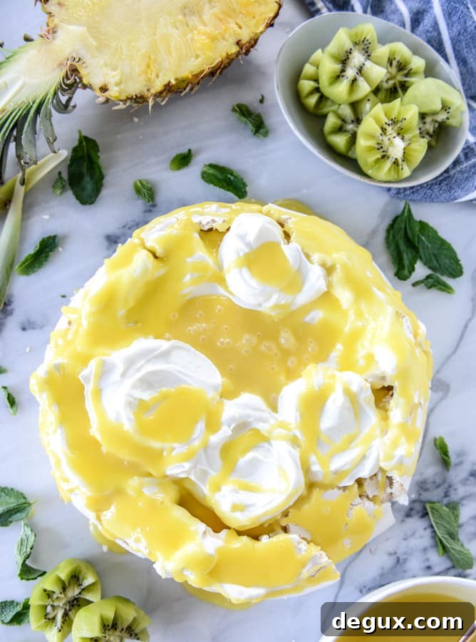 marshmallow pavlova with pineapple curd I howsweeteats.com