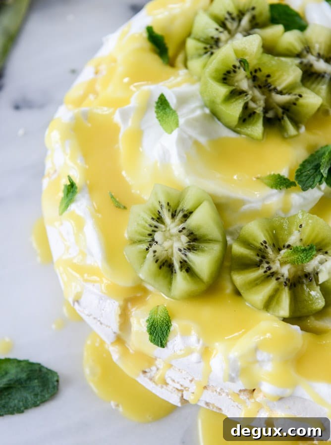 marshmallow pavlova with pineapple curd I howsweeteats.com
