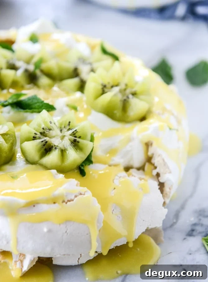 marshmallow pavlova with pineapple curd I howsweeteats.com