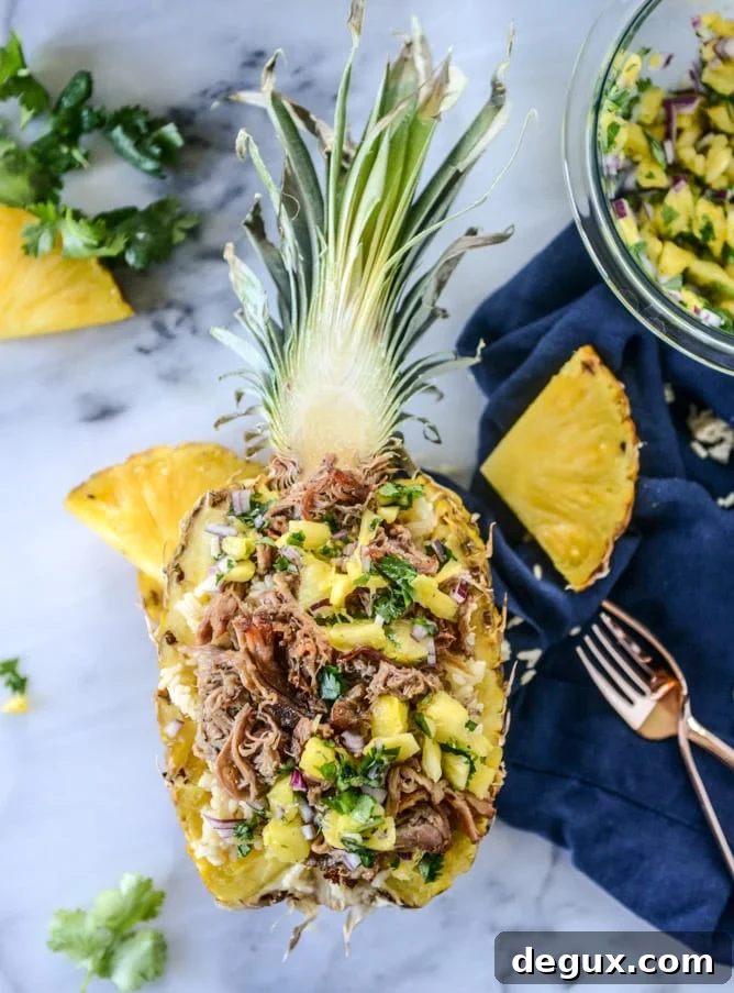 Slow Cooker Jerk Pork Pineapple Rice Bowls for Flavorful Dinners 2 slow cooker jerk pork in pineapple rice bowls I howsweeteats.com