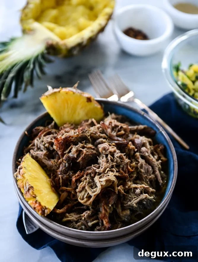 Slow Cooker Jerk Pork Pineapple Rice Bowls for Flavorful Dinners 4 slow cooker jerk pork in pineapple rice bowls I howsweeteats.com