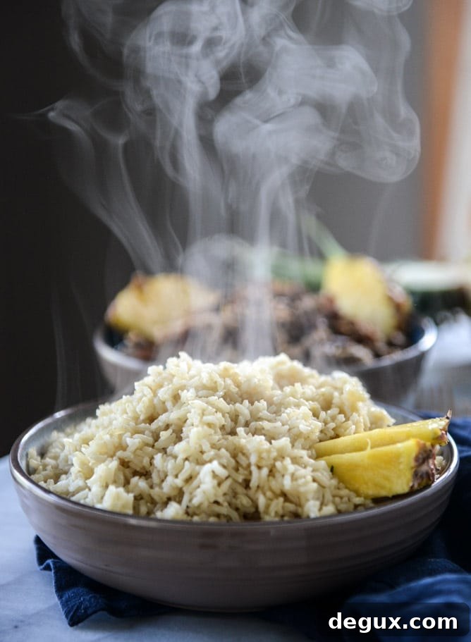 Slow Cooker Jerk Pork Pineapple Rice Bowls for Flavorful Dinners 5 slow cooker jerk pork in pineapple rice bowls I howsweeteats.com