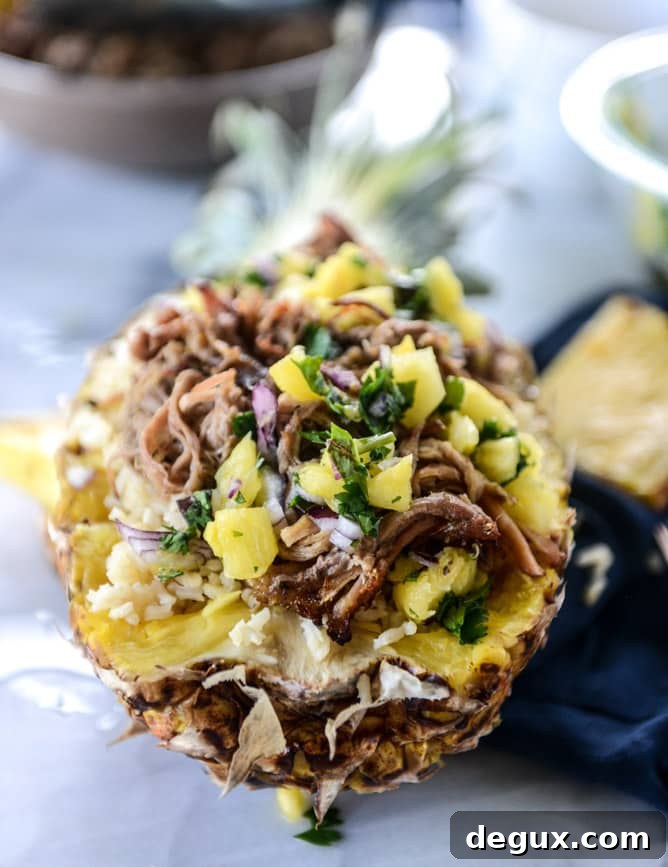 Slow Cooker Jerk Pork Pineapple Rice Bowls for Flavorful Dinners 7 slow cooker jerk pork in pineapple rice bowls I howsweeteats.com