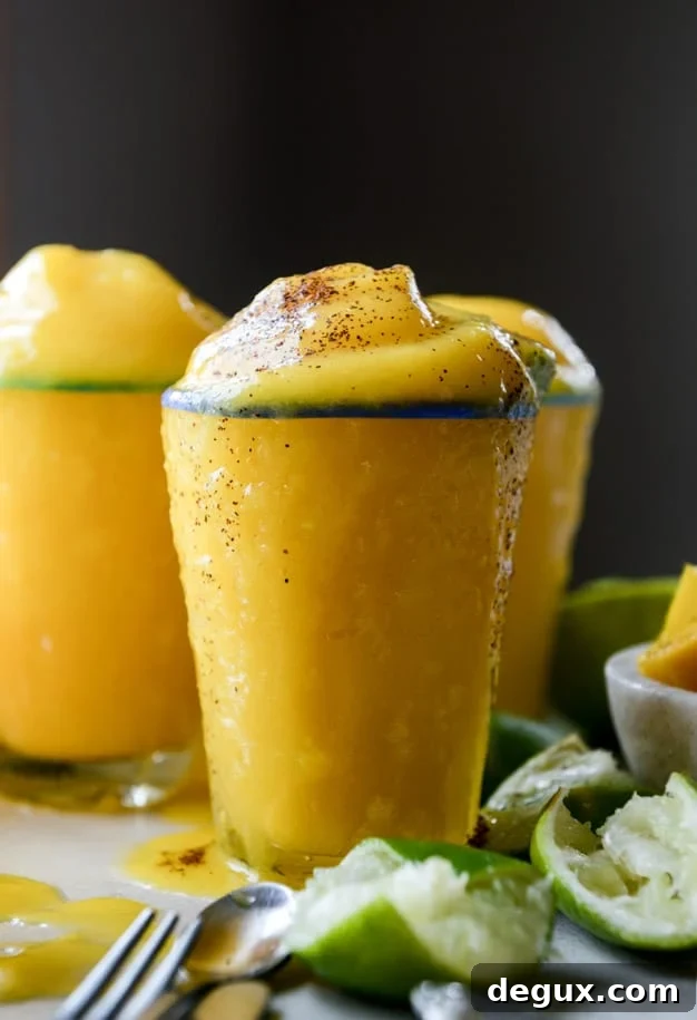 Mango Margarita Frosty Recipe — Creamy Frozen Cocktail Guide 2 fresh mango margarita frosty I howsweeteats.com
