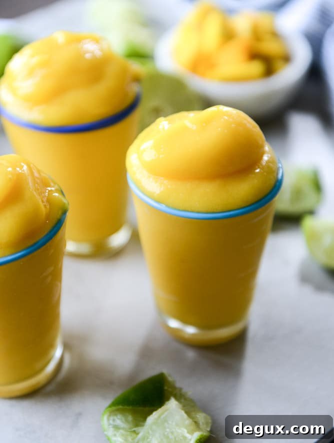 Mango Margarita Frosty Recipe — Creamy Frozen Cocktail Guide 6 fresh mango margarita frosty I howsweeteats.com