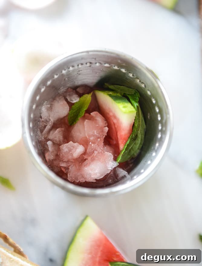 Watermelon Mint Julep Cocktail Recipe for Summer Sipping 4 fresh watermelon mint juleps I howsweeteats.com