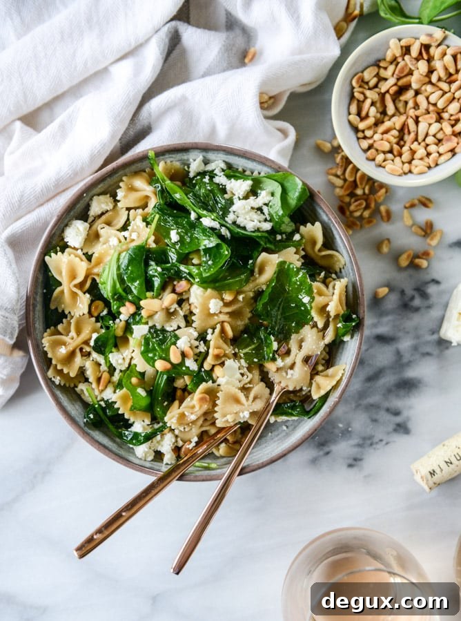 farfalle with marinated feta, arugula and toasted pine nuts I howsweeteats.com