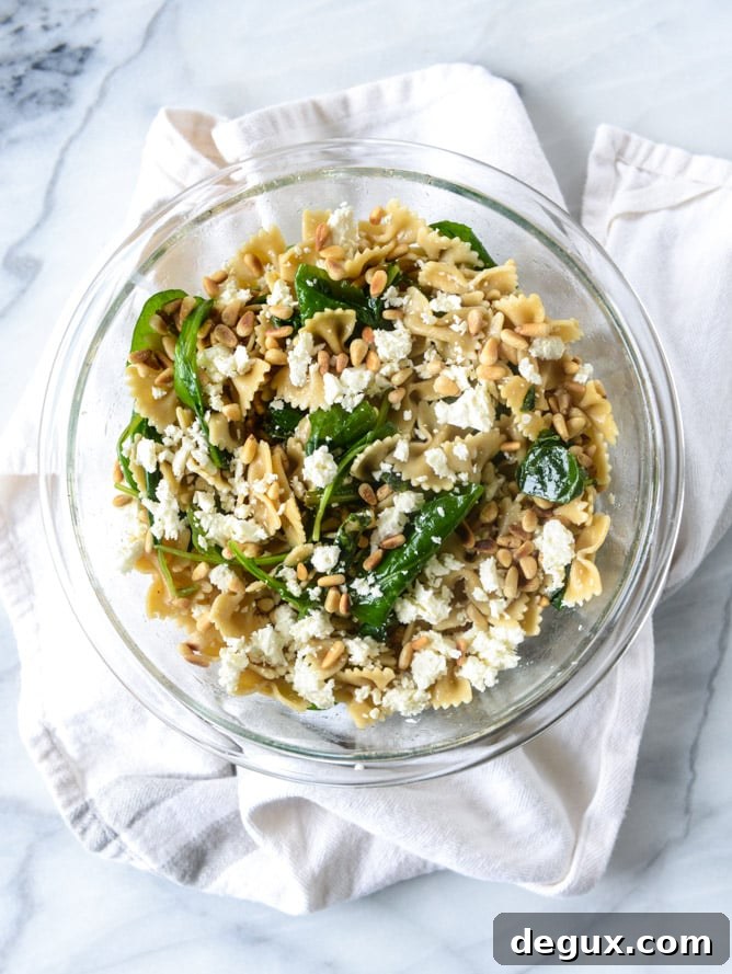 farfalle with marinated feta, arugula and toasted pine nuts I howsweeteats.com