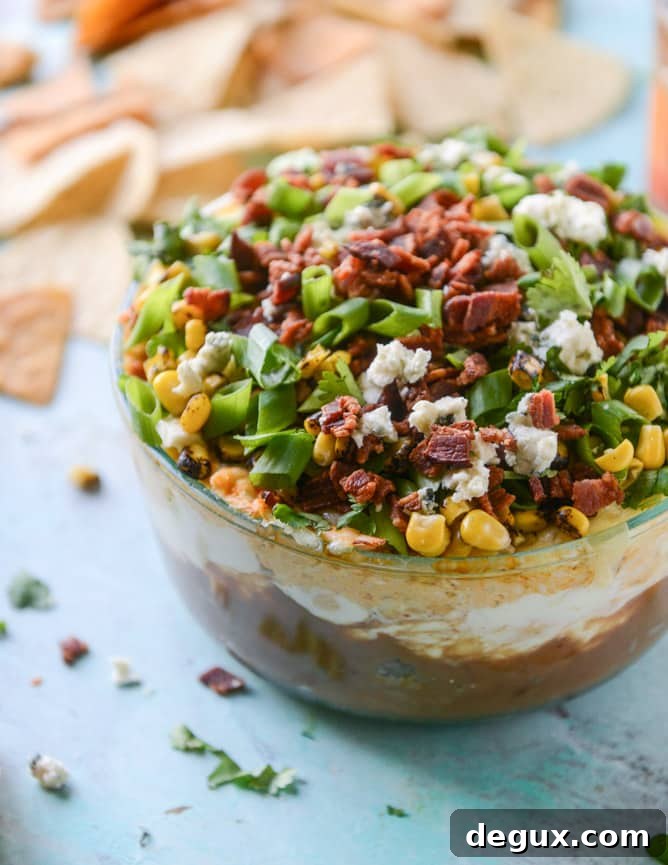 Layered Buffalo Chicken Dip Recipe: Creamy, Cheesy Party Dip 2 layered buffalo chicken dip I howsweeteats.com
