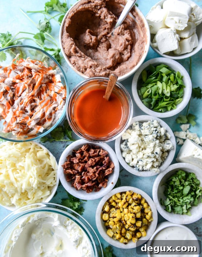 Layered Buffalo Chicken Dip Recipe: Creamy, Cheesy Party Dip 3 layered buffalo chicken dip I howsweeteats.com