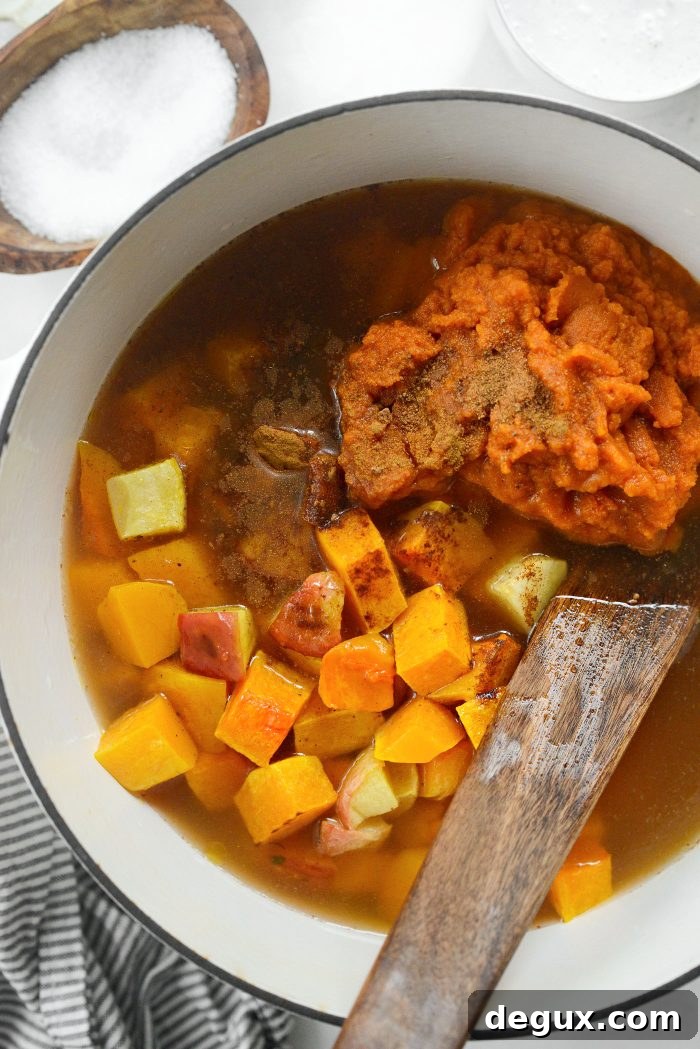 add squash, apples, pumpkin, maple syrup, spices and broth to the pot