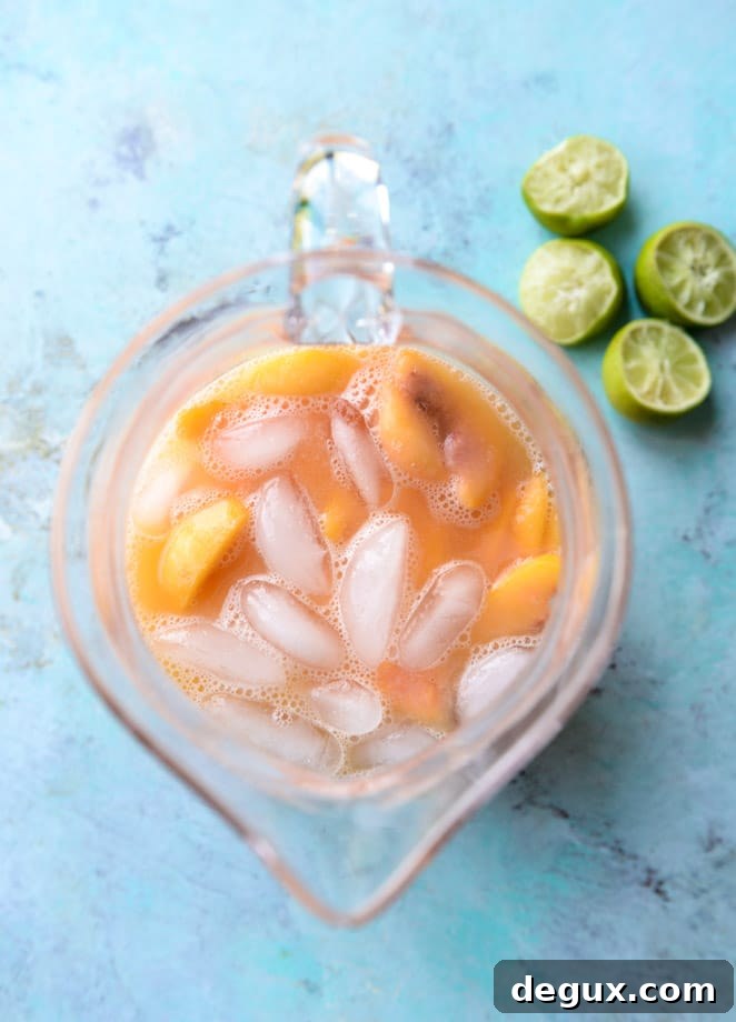 Pineapple and Peach Agua Fresca Recipe for Refreshing Summer Drinks 5 pineapple peach agua fresca I howsweeteats.com