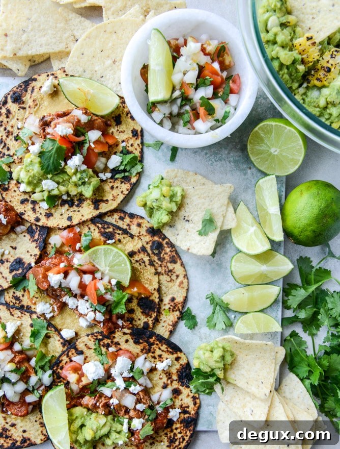 chicken tinga tacos with grilled corn guacamole by @howsweeteats I howsweeteats.com