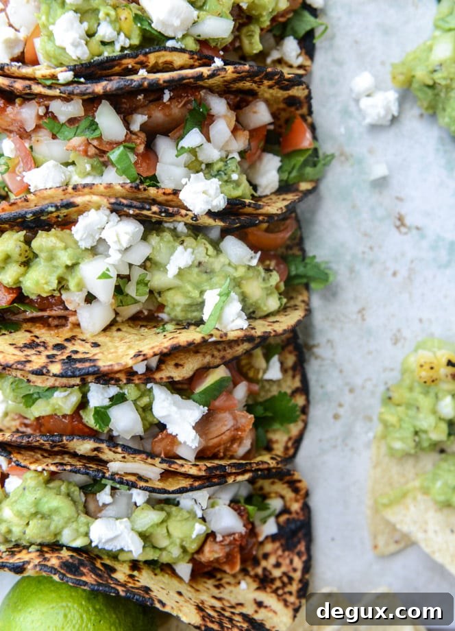 chicken tinga tacos with grilled corn guacamole by @howsweeteats I howsweeteats.com