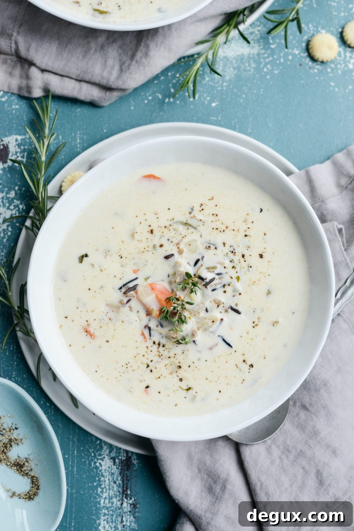 Homemade Turkey and Wild Rice Soup Recipe for Leftovers 13 white bowl of Turkey Wild Rice Soup.