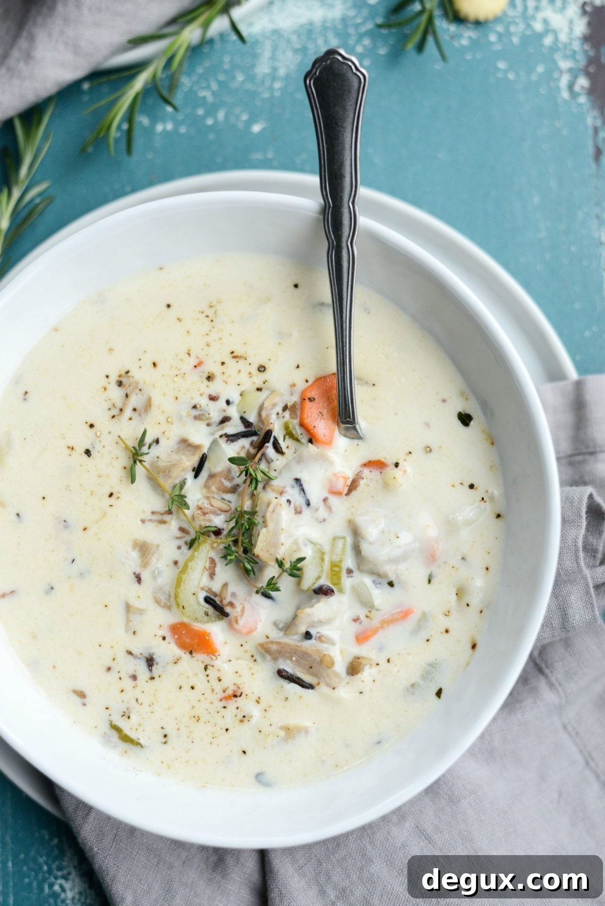 Homemade Turkey and Wild Rice Soup Recipe for Leftovers 16 Turkey Wild Rice Soup bowl with spoon.