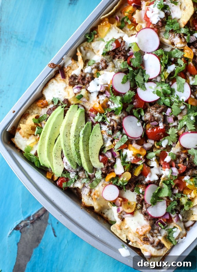 Sheet Pan Green Chile Beef Nachos Recipe 11 sheet pan green chile nachos I howsweeteats.com