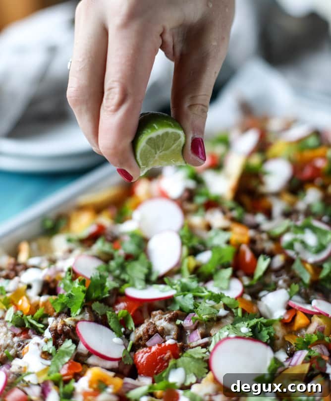 Sheet Pan Green Chile Beef Nachos Recipe 7 sheet pan green chile nachos I howsweeteats.com