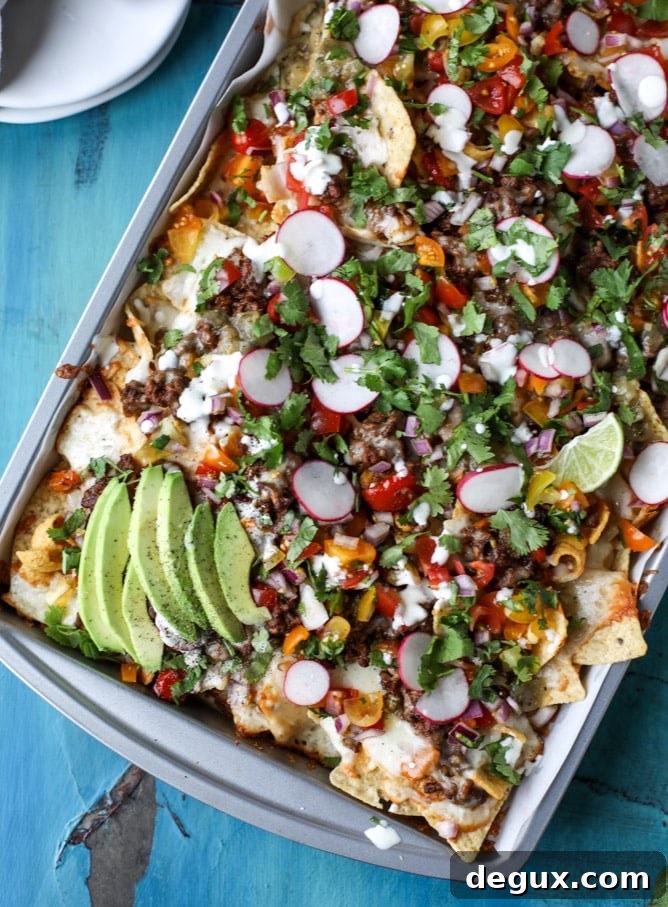 Sheet Pan Green Chile Beef Nachos Recipe 8 sheet pan green chile nachos I howsweeteats.com