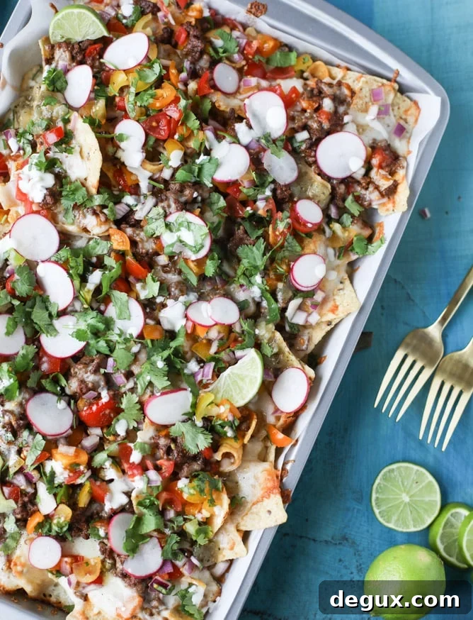 Sheet Pan Green Chile Beef Nachos Recipe 9 sheet pan green chile nachos I howsweeteats.com