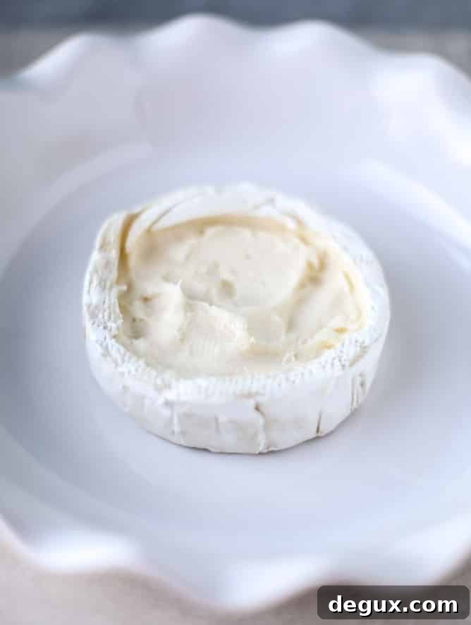 Caramelized Winter Fruit–Stuffed Brie with Pinot-Poached Pear (Video) 3 winter fruit stuffed brie with a pinot poached pear