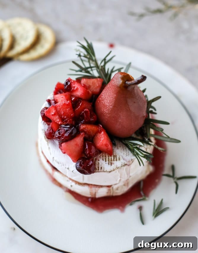 Caramelized Winter Fruit–Stuffed Brie with Pinot-Poached Pear (Video) 7 winter fruit stuffed brie with a pinot poached pear