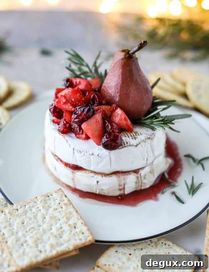 Caramelized Winter Fruit–Stuffed Brie with Pinot-Poached Pear (Video) 8 winter fruit stuffed brie with a pinot poached pear