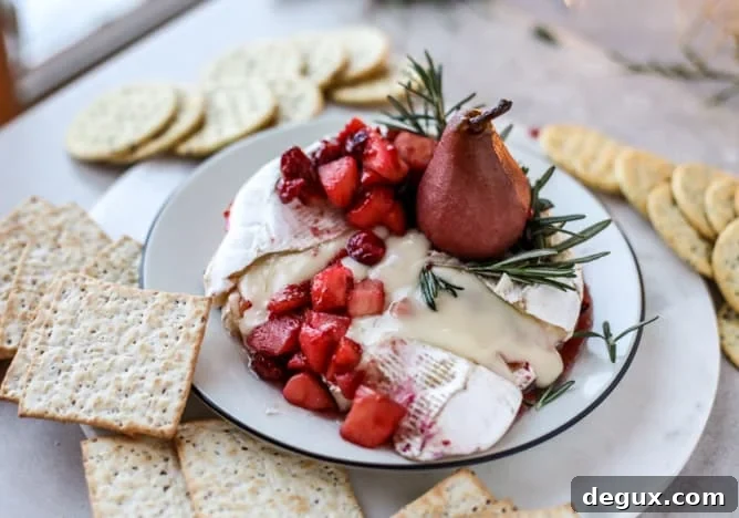 Caramelized Winter Fruit–Stuffed Brie with Pinot-Poached Pear (Video) 10 winter fruit stuffed brie with a pinot poached pear